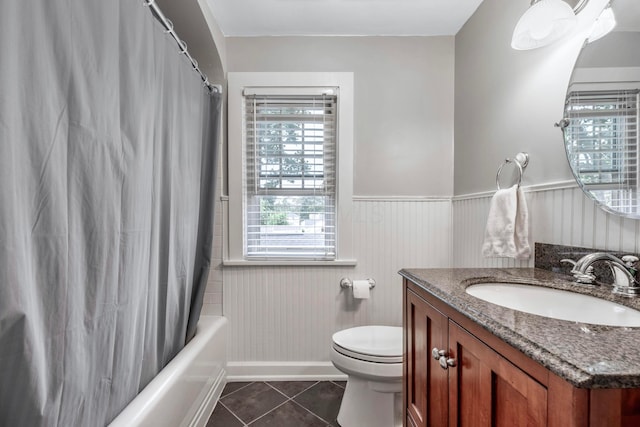 750 E Allen St, Lancaster, OH 43130 - full bathroom with tile patterned flooring, vanity, toilet, wainscoting, and shower / bath combo