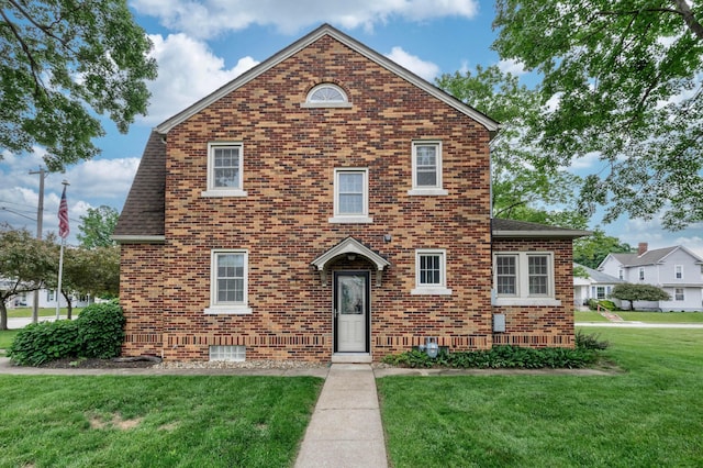 750 E Allen St, Lancaster, OH 43130 - view of front of property featuring brick siding, a front lawn, and a shingled roof