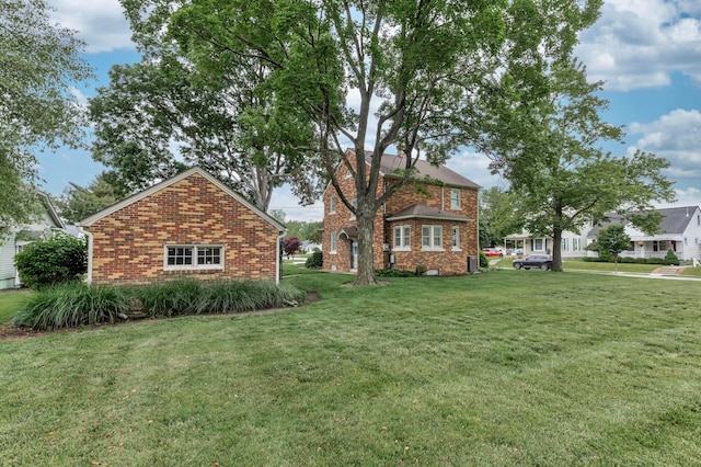 750 E Allen St, Lancaster, OH 43130 - view of side of property with brick siding and a lawn