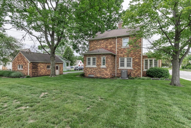 750 E Allen St, Lancaster, OH 43130 - back of property featuring a yard, cooling unit, a chimney, and brick siding