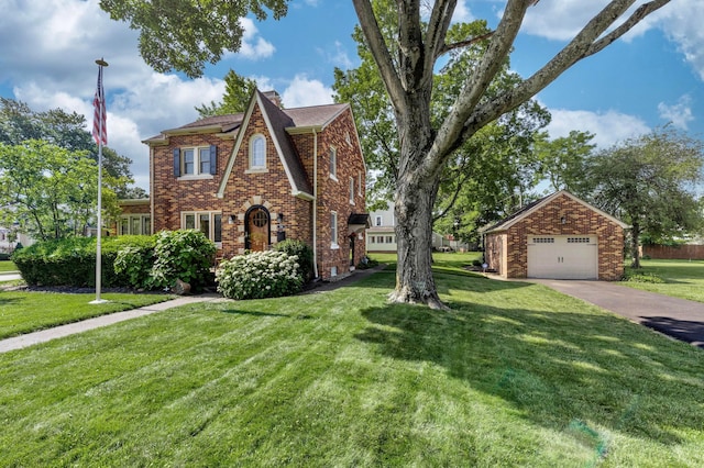 750 E Allen St, Lancaster, OH 43130 - view of front facade with brick siding, a garage, a front yard, an outbuilding, and concrete driveway