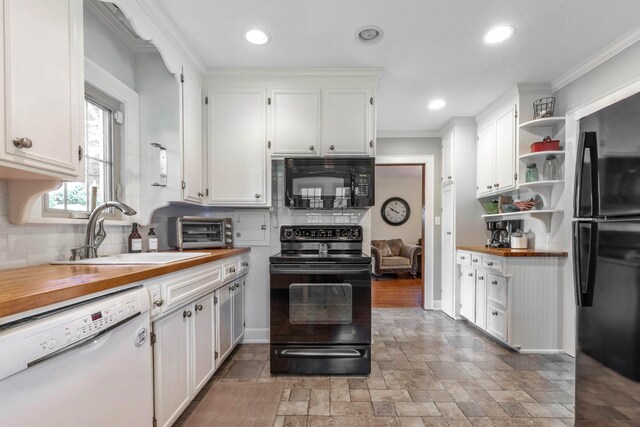 750 E Allen St, Lancaster, OH 43130 - kitchen with black appliances, butcher block countertops, open shelves, backsplash, and ornamental molding