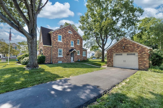 750 E Allen St, Lancaster, OH 43130 - traditional-style house with brick siding, a chimney, a front yard, a garage, and asphalt driveway