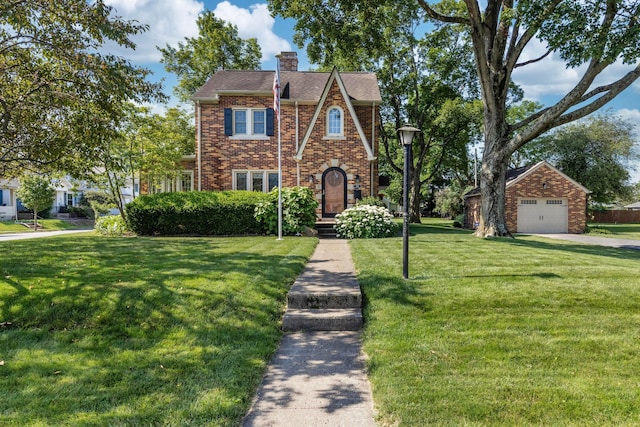 750 E Allen St, Lancaster, OH 43130 - tudor house with brick siding, a chimney, and a front yard
