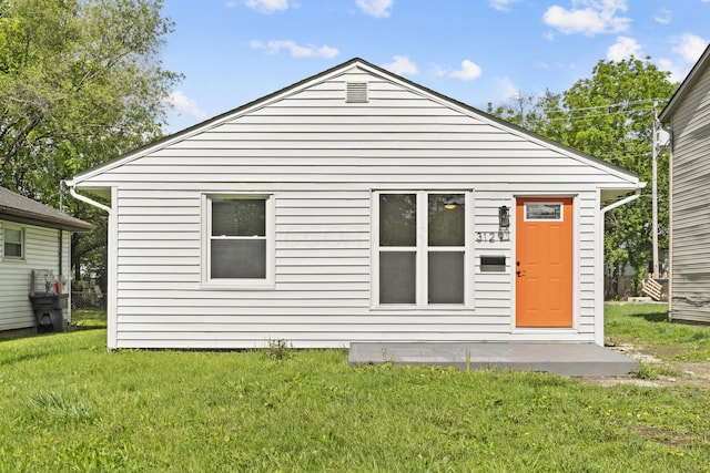 3129 Mcguffey Rd, Columbus, OH 43224 - rear view of house featuring a yard