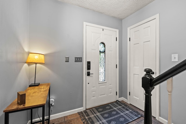 1997 Sutter Pkwy, Dublin, OH 43016 - foyer entrance with baseboards and dark tile patterned flooring