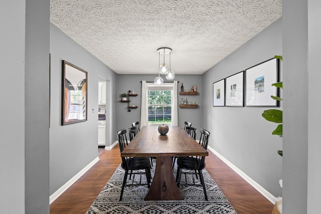 1997 Sutter Pkwy, Dublin, OH 43016 - dining area featuring dark wood-style floors, baseboards, and a textured ceiling