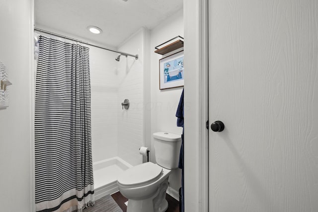 1997 Sutter Pkwy, Dublin, OH 43016 - full bathroom featuring a shower with shower curtain, toilet, and wood finished floors