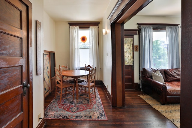 2045 N 4th St, Columbus, OH 43201 - dining space with plenty of natural light, dark wood finished floors, and baseboards