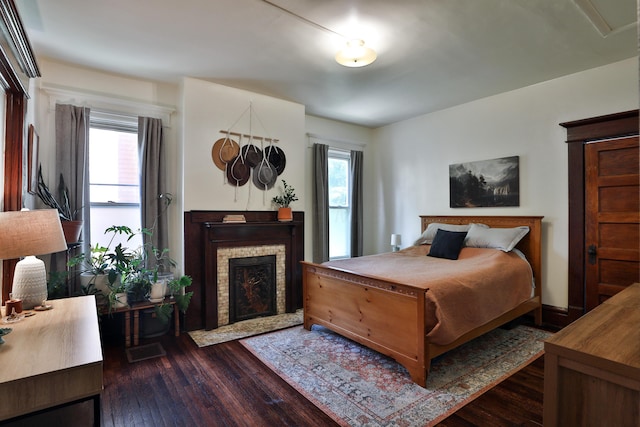 2045 N 4th St, Columbus, OH 43201 - bedroom featuring dark wood finished floors and a fireplace