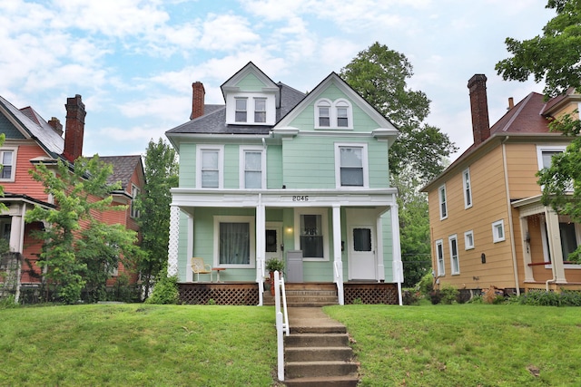 2045 N 4th St, Columbus, OH 43201 - view of front of property with a porch and a front lawn