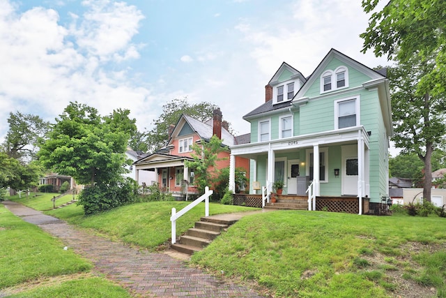 2045 N 4th St, Columbus, OH 43201 - view of front facade with a porch and a front yard