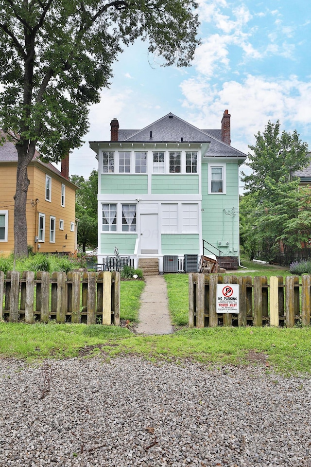 2045 N 4th St, Columbus, OH 43201 - view of front of home featuring a chimney and a shingled roof