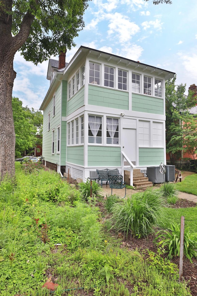2045 N 4th St, Columbus, OH 43201 - view of front facade with entry steps and a chimney