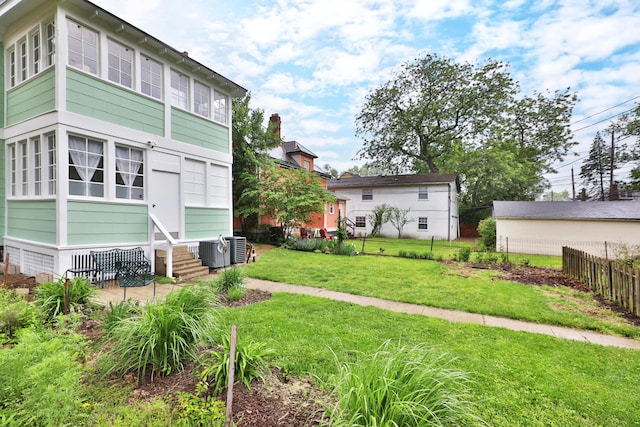2045 N 4th St, Columbus, OH 43201 - back of house featuring central AC and entry steps
