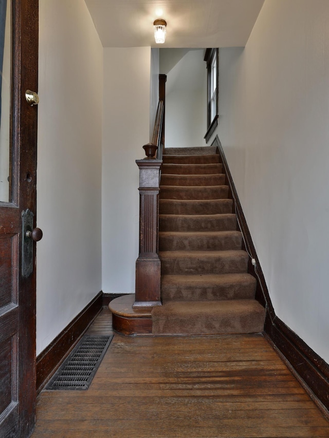 2045 N 4th St, Columbus, OH 43201 - stairway featuring wood finished floors and baseboards