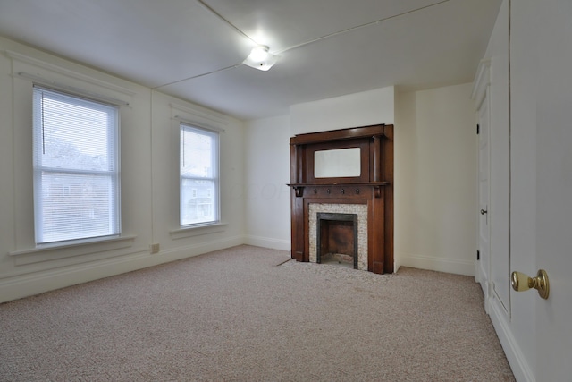 2045 N 4th St, Columbus, OH 43201 - unfurnished living room with carpet floors, a fireplace, and baseboards