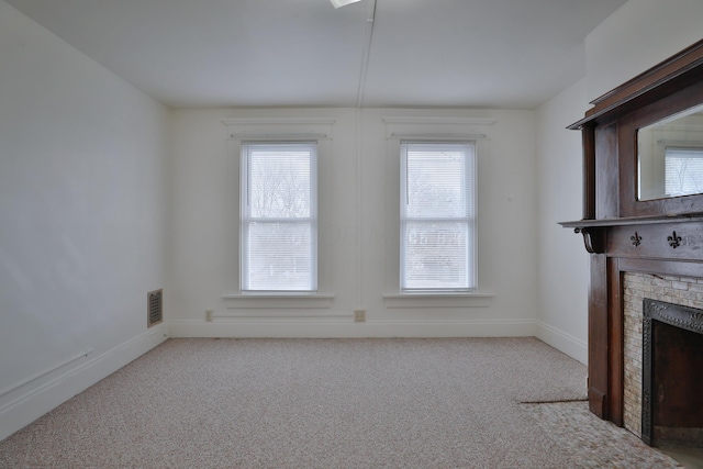 2045 N 4th St, Columbus, OH 43201 - unfurnished living room with a fireplace, carpet flooring, and baseboards