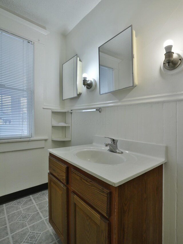 2045 N 4th St, Columbus, OH 43201 - bathroom featuring vanity and wainscoting