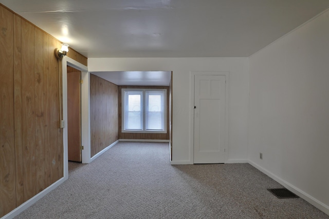 2045 N 4th St, Columbus, OH 43201 - carpeted spare room featuring baseboards and wooden walls
