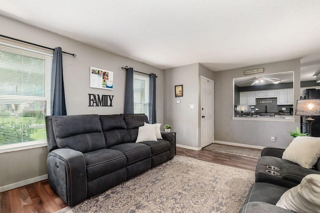 4419 Trindel Way, Columbus, OH 43231 - living room with baseboards, dark wood-style flooring, and a ceiling fan