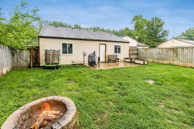 4419 Trindel Way, Columbus, OH 43231 - rear view of property with an outdoor fire pit, a patio area, and roof with shingles