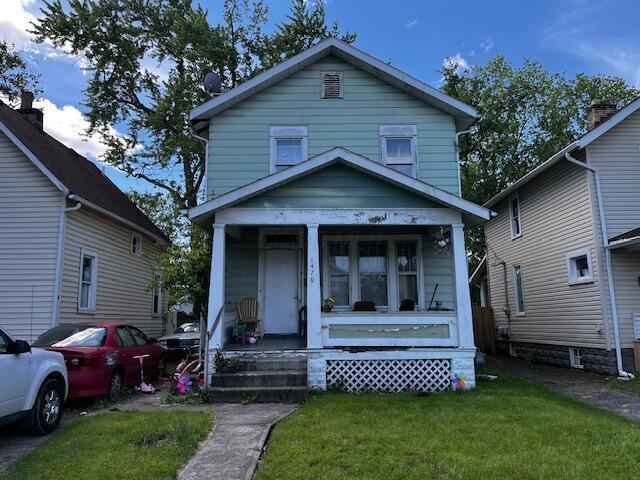 1479 Genessee Ave, Columbus, OH 43211 - view of front of home with covered porch and a front lawn