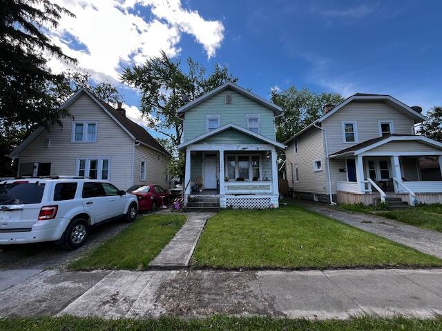 1479 Genessee Ave, Columbus, OH 43211 - view of front facade with covered porch and a front yard