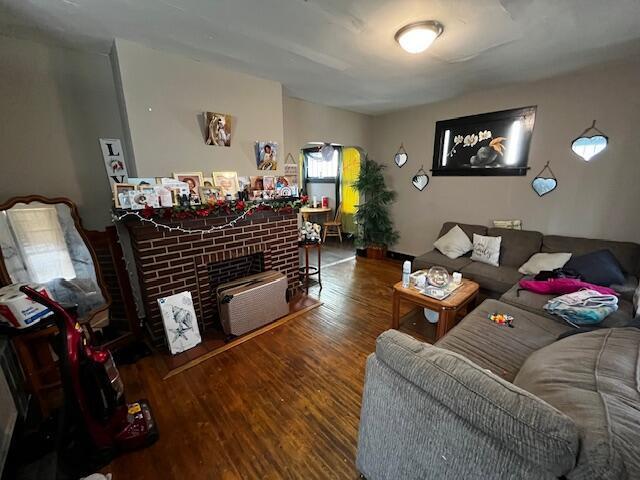 1479 Genessee Ave, Columbus, OH 43211 - living room featuring wood finished floors and a fireplace