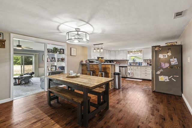 21171 River Rd, Circleville, OH 43113 - dining space featuring dark wood-style flooring, baseboards, and a chandelier