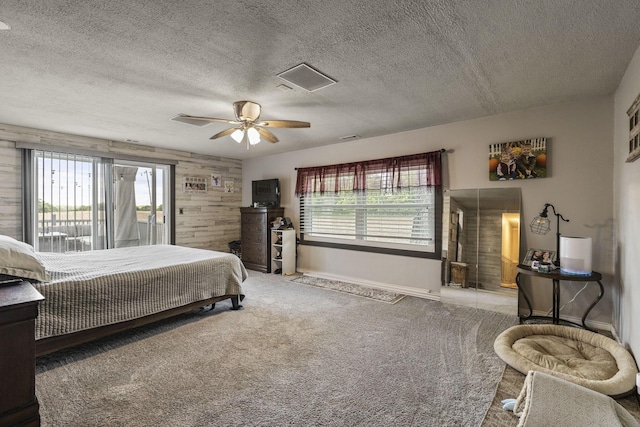 21171 River Rd, Circleville, OH 43113 - bedroom featuring baseboards, a textured ceiling, carpet, and ceiling fan