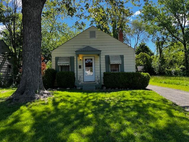2428 Bancroft St, Columbus, OH 43211 - view of front of home featuring a chimney and a front yard