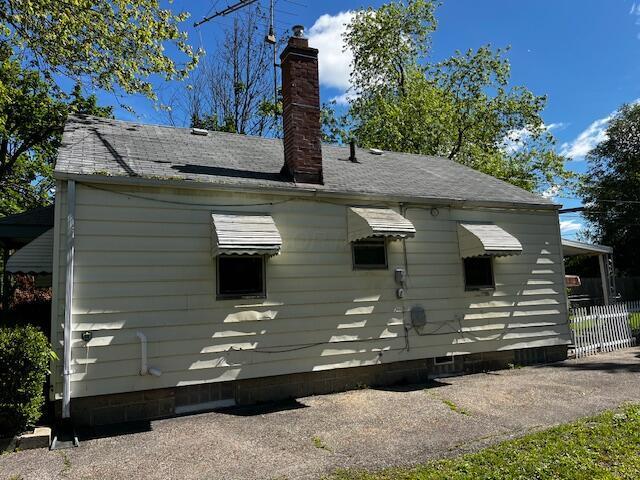 2428 Bancroft St, Columbus, OH 43211 - rear view of property with a chimney and crawl space