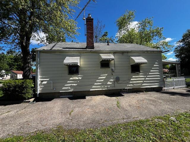 2428 Bancroft St, Columbus, OH 43211 - back of house with a chimney and crawl space