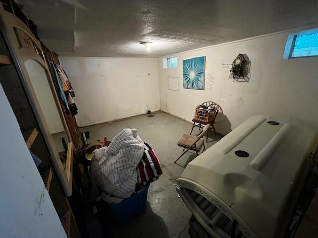 2428 Bancroft St, Columbus, OH 43211 - basement featuring healthy amount of natural light and a textured ceiling