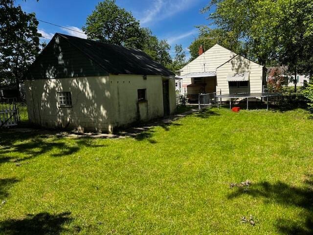 2428 Bancroft St, Columbus, OH 43211 - rear view of property with a lawn and a chimney