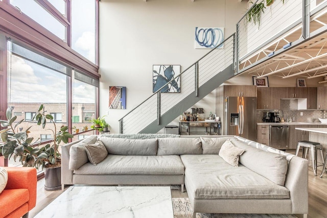 367 Auden Ave Unit 306, Columbus, OH 43215 - living area featuring wood finished floors and a high ceiling