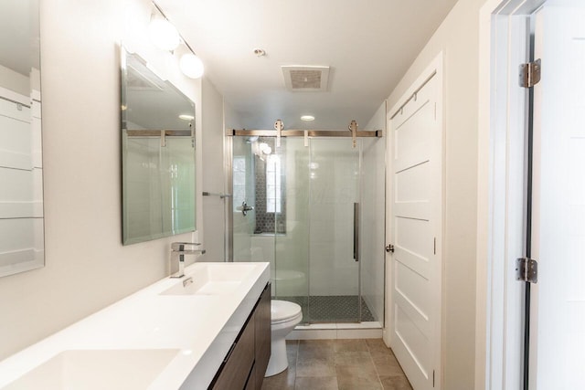 367 Auden Ave Unit 306, Columbus, OH 43215 - full bath with toilet, a stall shower, double vanity, recessed lighting, and tile patterned floors