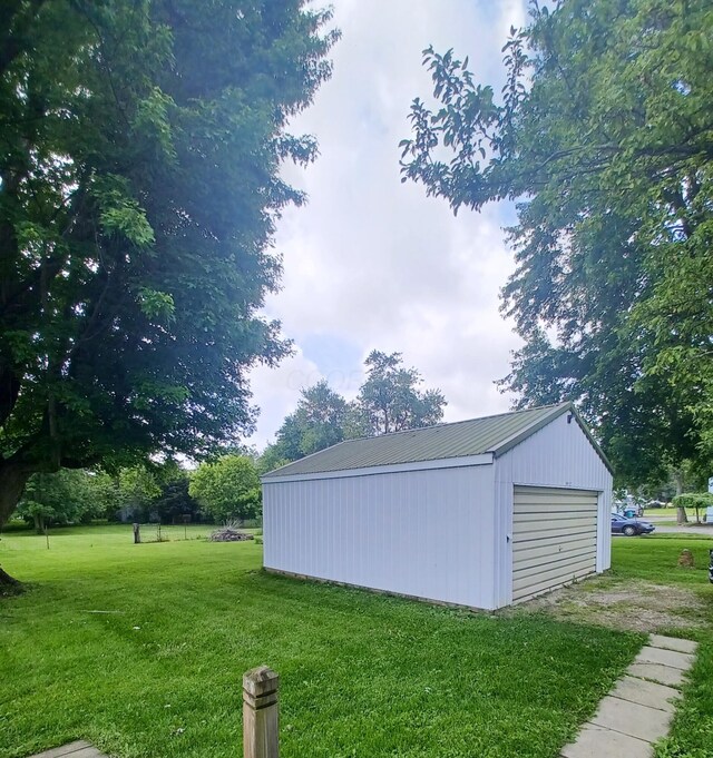 4891 Marion Mount Gilead Rd, Caledonia, OH 43314 - view of green lawn featuring an outdoor structure and a detached garage