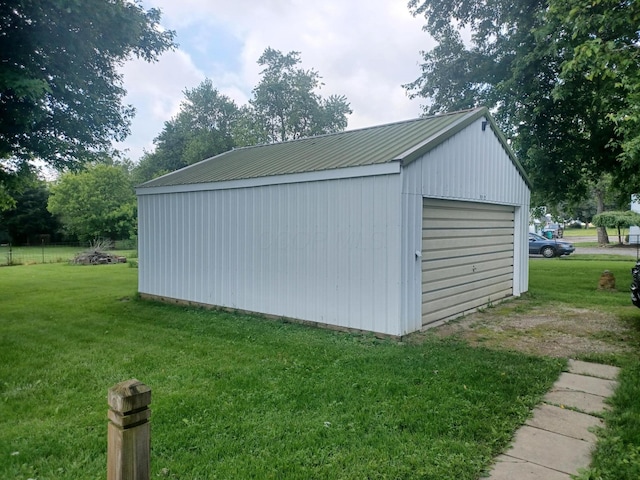 4891 Marion Mount Gilead Rd, Caledonia, OH 43314 - detached garage featuring view of wooded area