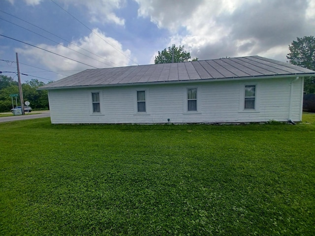 4891 Marion Mount Gilead Rd, Caledonia, OH 43314 - view of property exterior with a yard, metal roof, and a standing seam roof
