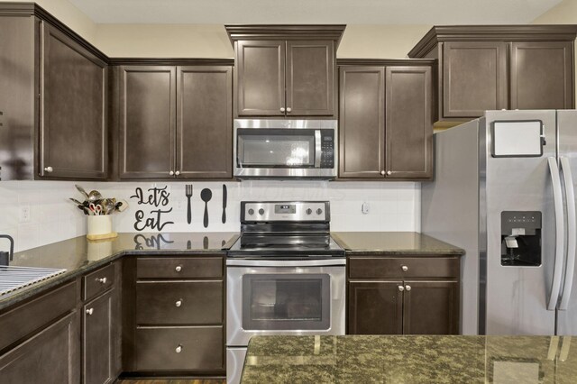 7142 Duke Dr, Canal Winchester, OH 43110 - kitchen featuring appliances with stainless steel finishes and dark stone counters