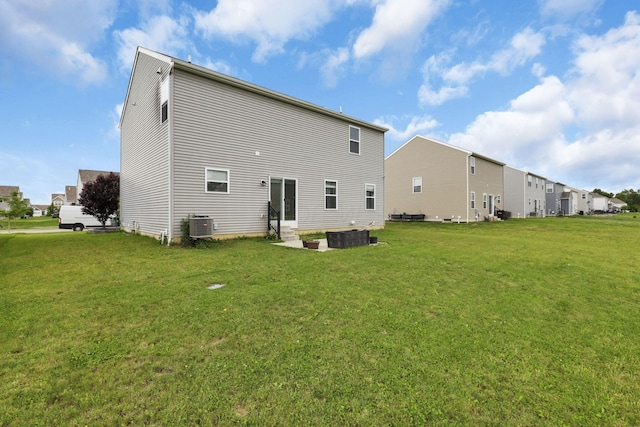 7142 Duke Dr, Canal Winchester, OH 43110 - rear view of house featuring a lawn and central air condition unit