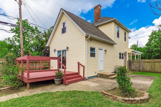 471 Southwood Ave, Columbus, OH 43207 - back of house featuring a chimney, a shingled roof, a wooden deck, and a patio