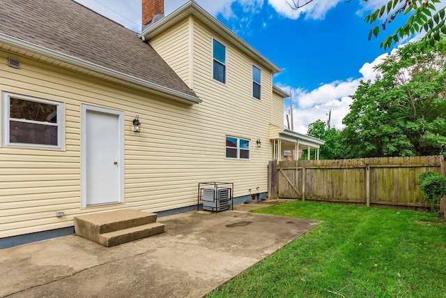 471 Southwood Ave, Columbus, OH 43207 - rear view of property featuring a shingled roof, a patio, and a chimney