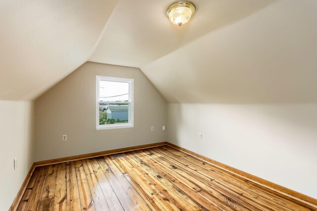 471 Southwood Ave, Columbus, OH 43207 - additional living space with light wood-style floors, baseboards, and lofted ceiling