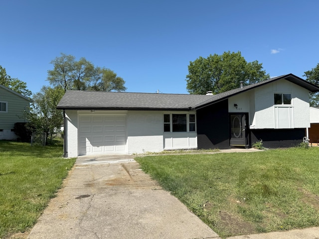 5123 Jameson Dr, Columbus, OH 43232 - view of front of house with brick siding, a garage, driveway, a front yard, and roof with shingles