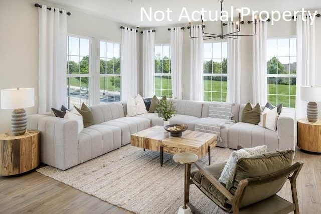 4179 Tuller Rd Lot 1104, Dublin, OH 43017 - living room with light wood-style flooring and a chandelier