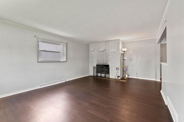 3191 S Stephen Dr, Columbus, OH 43204 - unfurnished living room with baseboard heating, a brick fireplace, wood finished floors, ornamental molding, and baseboards