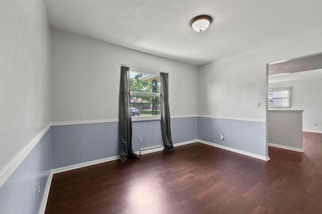 3191 S Stephen Dr, Columbus, OH 43204 - empty room featuring wood finished floors, baseboard heating, and baseboards